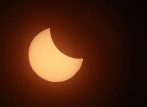 A partial solar eclipse is seen from Karachi August 1, 2008. Picture taken with special filter. REUTERS/Athar Hussain (PAKISTAN)